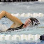 Cape freshman Madison Buchwald wins her heat in the 100 freestyle. BY DAN COOK