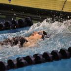 Sarah Rambo touches up to win the 100 backstroke with a 1:12.63. BY DAN COOK