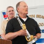 Dewey Beach Lions Club members Bob Frederick, left, and Bill Zolper present a ceremonial bugle to the fire company. BY DENY HOWETH