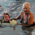 YMCA volunteer Gloria Campanelli teaches Patrick Healy during the WLSL. BY DAN COOK