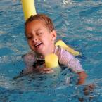Lucian Turcan, 4, has a great time on his pool noodle. BY DAN COOK