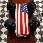 An honor guard carries Beau Biden's casket into Legislative Hall Thursday. BY ASSOCIATED PRESS