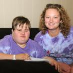 Relaxing in the recreation hall are SODE athlete Brittney Ashmead and counselor Carley Schiavoni. BY DAN COOK