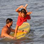 RBP junior guard Joe Giles dives off the paddle board held by RBP Lt. Matt Matsko to finish the paddleboard relay race. BY DAN COOK