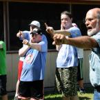 Teaching how to find the target during archery class is 4-H instructor Jim Kemble. BY DAN COOK