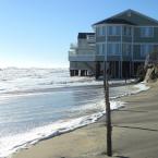Waves washed away a good amount of sand from underneath this house at the end of Beach Avenue just south of Dewey. BY CHRIS FLOOD