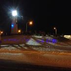 The blue lights of Coastal Club's lighthouse at Five Points in Lewes peeks through a layer of snow. BY CHRIS FLOOD