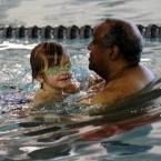 Decan Stewart, 5, gets a hand from volunteer Jim McIntyre. BY DAN COOK