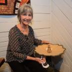 Carmela Coleman smiles with her Frog Bird Bath. STEVEN BILLUPS PHOTO Rehoboth Art League