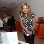 Aileen Forker inspects the many silent auction items. SCAOR