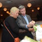 Melanie Anderson and Micah Parker check to see what wine they chose from the Wall of Wine. SCAOR
