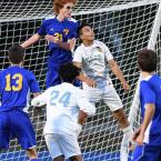 Cape’s Ilarion Swallow and Caesar Rodney’s Gabriel Buckley battle for a header in front of the Riders’ cage.