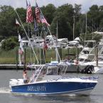 Flags flying high on the 31-foot Jupiter Impulsivity. Capt. Dave Klinger and his crew enjoy the trip down the canal.