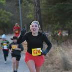 Megan Yoder acknowledges the cameraman as she runs to a time of 29:18.
