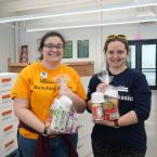 Shannon Stehle, left, and Jessica Colon, volunteers with Reading Assist at Booker T. Washington School in Dover, spent their day packing meal kits together at the Food Bank of Delaware.