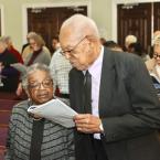 Ardeth and the Rev. George Edwards Sr. follow along in the program at the MLK Day service at Conley’s United Methodist Church.