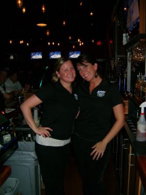 Morgan Whalen, left, stands will Chelsea Whittaker behind the bar at Bethany Blues where both girls work. Whittaker helped save a man’s life in February by using CPR. SOURCE SUBMITTED