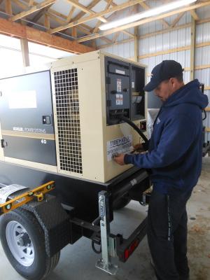 Tidewater Utilities maintenance mechanic Andy Bradford applies the finishing touches to a 40 kilowatt generator that will act as backup power if the wastewater treatment facility that supports the two Plantation communities near Lewes ever loses power. There is a second generator the same size as well as a 100 kilowatt generator. The utility company recently held an open house showing off improvements that cost about $500,000 and took nearly a year to complete. BY CHRIS FLOOD