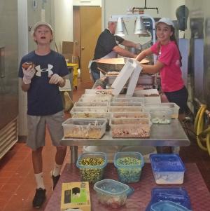 Students help make the doughnuts at Gooey Donuts in Milton. Pictured are (l-r) Ross Crockett, Doug Ingram and Marley Evans. SOURCE CARLY ZYCH