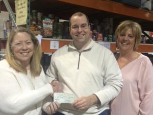 Shown are (l-r) Rita Hughes, treasurer for the Sussex County Democrats; Chad Robinson, Milford Branch director of the Food Bank of Delaware; and Paulette Rappa, corresponding secretary and communications chair for the Sussex County Democrats. SOURCE SUBMITTED