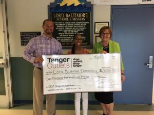 Shown are (l-r) Tanger Outlets Assistant General Manager Joey Venezia, Lord Baltimore Elementary technology teacher Whitney McMillon and Principal Pamela Webb. SUBMITTED PHOTO