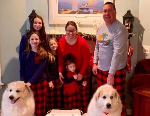 The Krajewski family celebrates excellent care at Beebe. Shown are (l-r) daughters Sarah (in back), Beth, Megan, and Caroline with parents Kate and Ron, and puppies Noah and Millie. SUBMITTED PHOTO