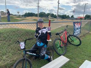 Greg Bingaman Jr. shows off his first-place trophy, which he earned at a qualifying race in Milford. SUBMITTED PHOTOS