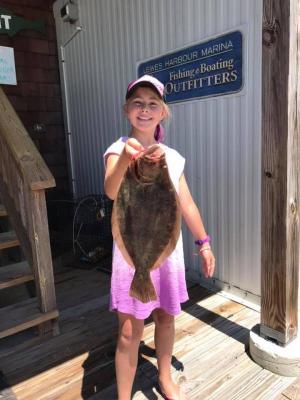 Miss Olivia DiFebo caught this 20-inch flounder out of the Lewes-Rehoboth Canal on a minnow and white Gulp! combination. SOURCE: LEWES HARBOUR MARINA
