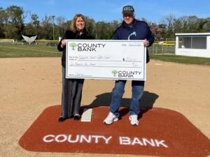 Check presentation attendees shown are (l-r) County Bank Rehoboth Beach branch manager Sandi Walker and Rehoboth Beach Little League board member Nick DelCampo. SUBMITTED PHOTO