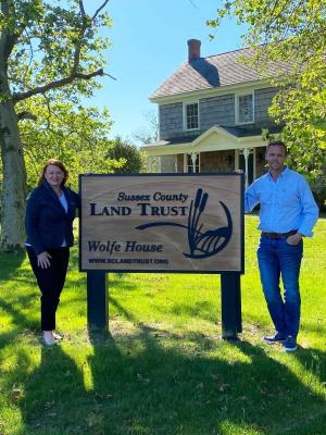 Newly elected Sussex County Land Trust Chair Heidi Gilmore and outgoing Chair Casey Kenton pause for a photo at the Wolfe House, the Sussex County Land Trust headquarters on Wolfe Neck Road north of Rehoboth Beach. SUBMITTED PHOTO