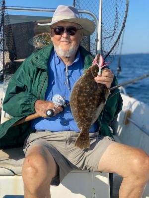 Your hardworking outdoor reporter shows off the 22-inch flounder he caught out of Manasquan Inlet last week. ROGER BURNLEY PHOTO