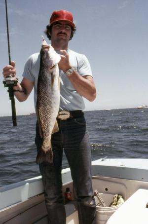 Mark Legget hoists a Delaware Bay trout caught on a Newport Lures bucktail. ERIC BURNLEY PHOTO