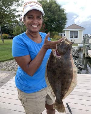 Shazmin Stearn caught this 5-pound flounder from her family dock on a minnow and a rig she purchased at Lewes Harbour Marina. LEWES HARBOUR MARINA PHOTO