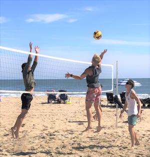 In AAA men’s action, James Moyer attacks while Ryan Love is ready to play off the block. STEVE MCNULTY PHOTO