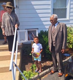 Gathered beside the little library at Friendship Baptist Church are (l-r) Alicia Jones, Sean Hopkins Jr. and the Rev. George Edwards. SUBMITTED PHOTOS