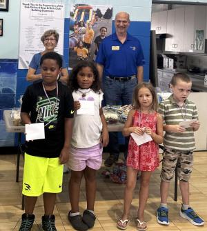 Oak Orchard Boys & Girls Club children celebrating July birthdays are in front (l-r) Dominic Mac, Aniyah Hopkins, Oliva Deptula and Logan McDaniel. In back are Rotarians Cathy Cardaneo and Max Hutsell. SUBMITTED PHOTO