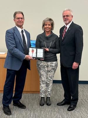 Gathered for the presentation of a plaque honoring the late Ted Becker are (l-r) Jim Ford, Fourth Street Preserve campaign chair; Ellen Lorraine McCabe, Lewes city manager; and Mike Petit deMange, former Kent County administrator and first DFIT vice chair. SUBMITTED PHOTO