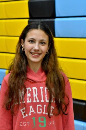 Cape senior Dyleen Enright kicked off state wrestling competitions by singing the national anthem. DAVE FREDERICK PHOTOS